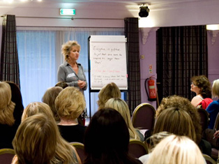 Dr Susie Mitchell pictured delivering a training course/workshop on Sales and leadership available throughout the UK